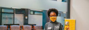 Latifa sitting in the admissions office.