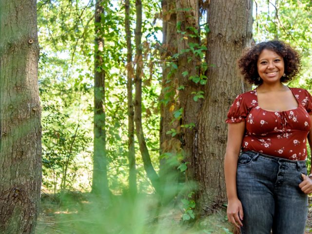 Destiny Hall standing a fall forest.