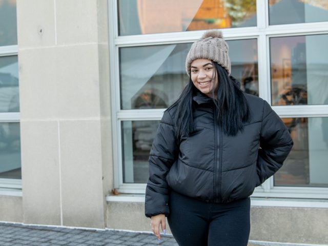 Caitlin standing outside of the library.