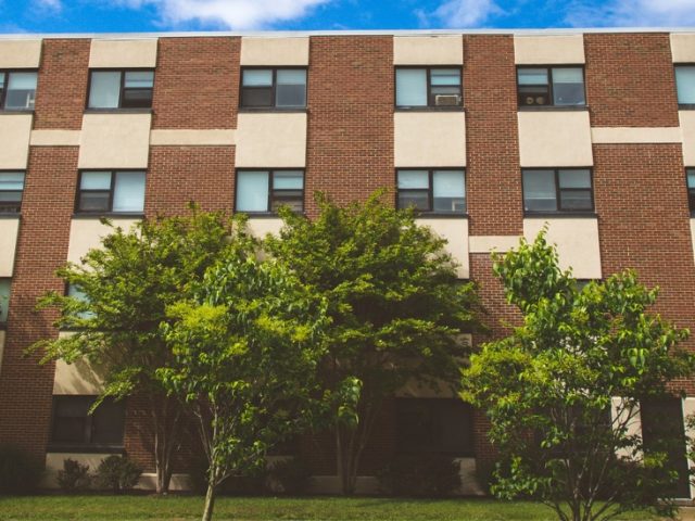 an upward pan view of the broad side of Mimosa Hall.