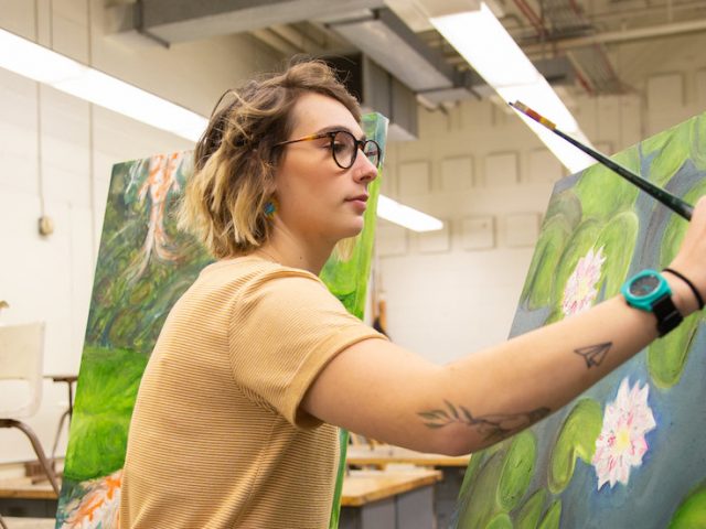 Jess Hedum working on a sensory art painting.