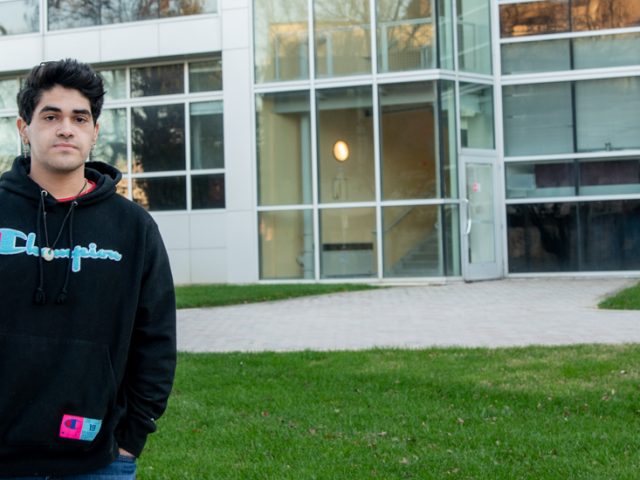 Emilio standing outside of the Science building.