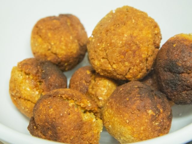 A few falafels in a bowl.