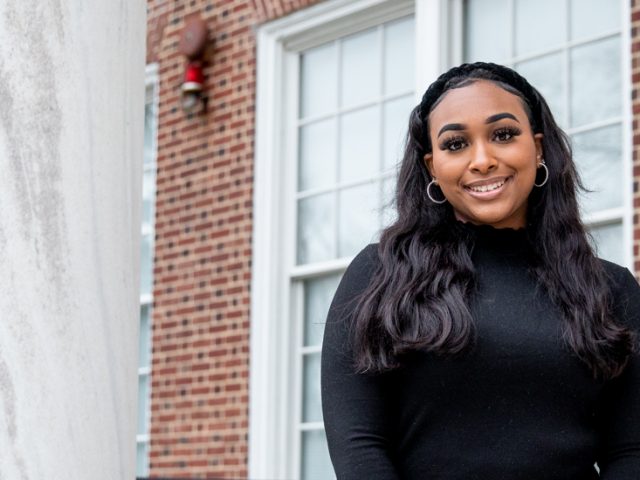 Jada standing outside of Bunce Hall.