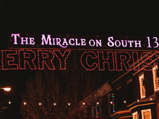 A lit up sign at night.