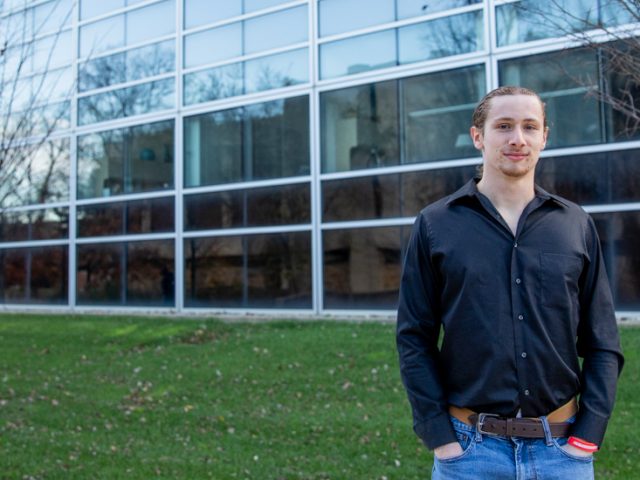 Tom standing outside of the Science building.