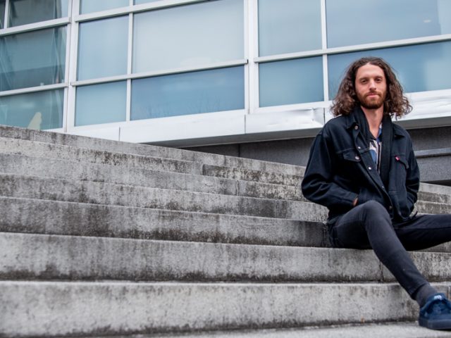 Bob poses on the stairs by the Engineering building.