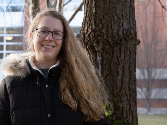 Taryn poses outside the library.