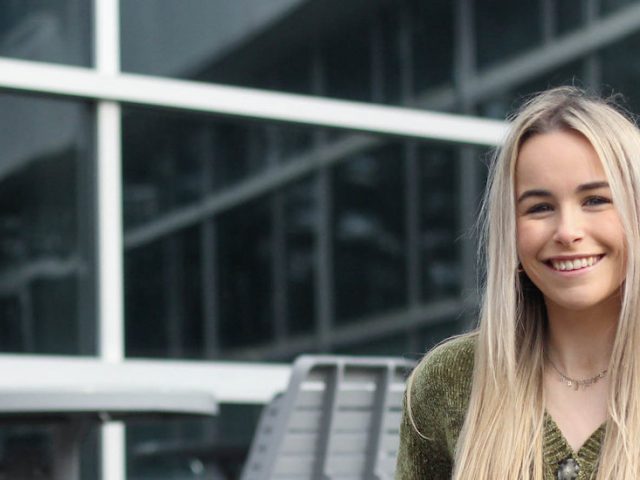 A headshot of Madison Sweet outside on Rowan's campus.