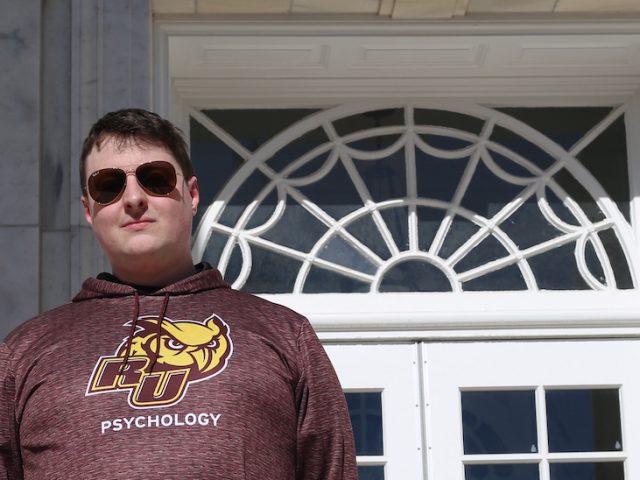 John stands outside Bunce Hall.