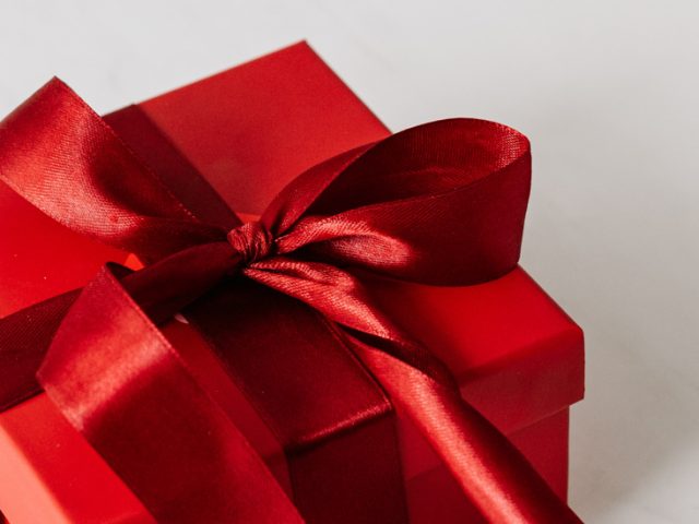 Red gift box with bow.