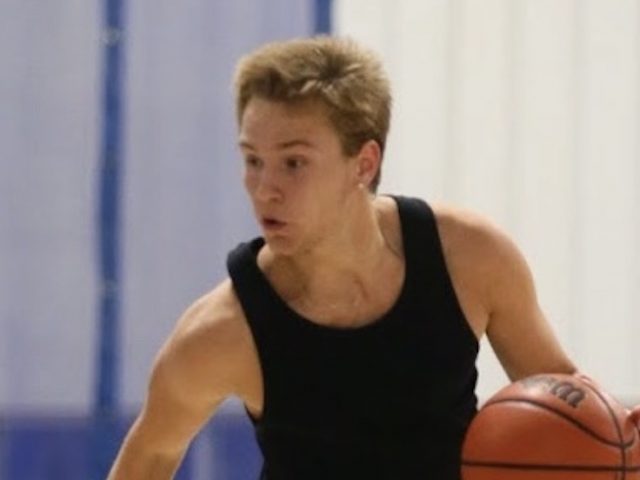 An action shot of Bobby playing basketball.