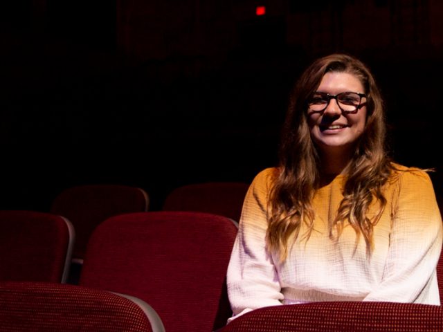 Julia sitting in the audience.