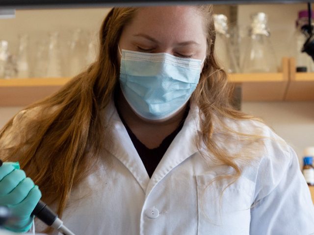 A Rowan Bioinformatics student in the lab.