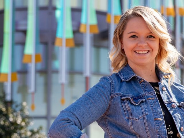 Kaitlyn in front of Business Hall.