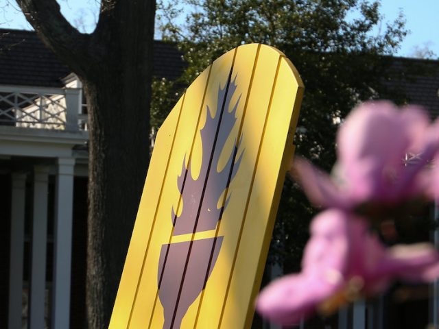 An outdoor photo of a branded chair on campus.