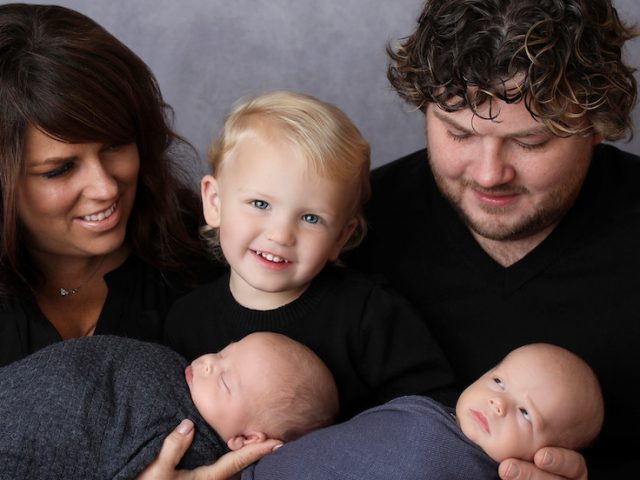 Lauren, her husband, and her 3 kids pose for a family photo.