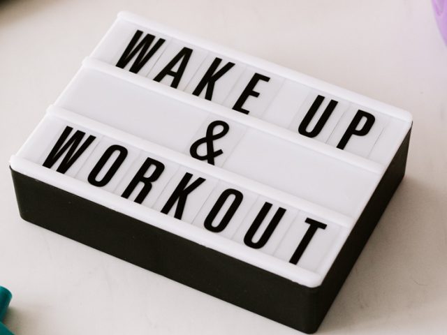 A sign that says Wake up and Workout.