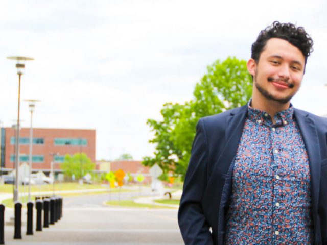 DJ standing under Engineering Building