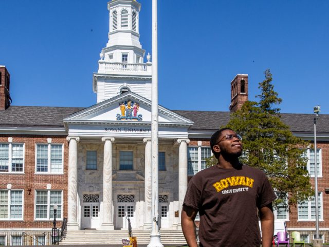 Alex stands in front of Bunce Hall