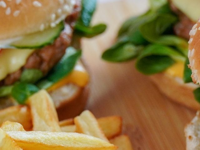 Stock image of burgers with a side of French fries.