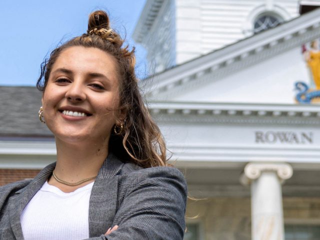 Mia stands in front of Bunce Hall.