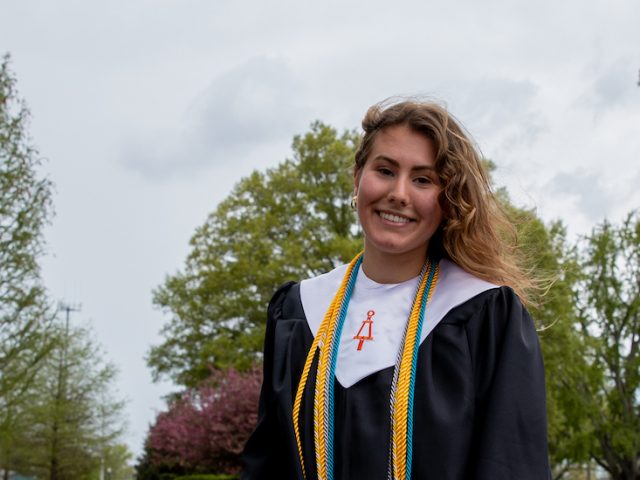 Alexa stands in front of the Rowan arch.