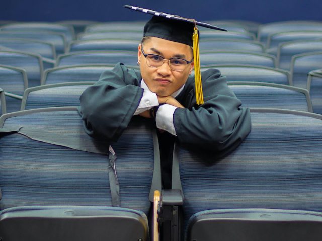 Riel makes a funny face while sitting in the Bozorth Hall Auditorium.