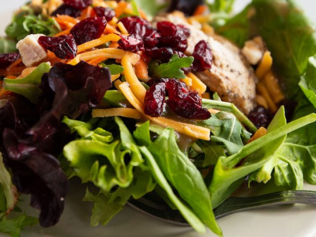 Plated salad on a white dish.