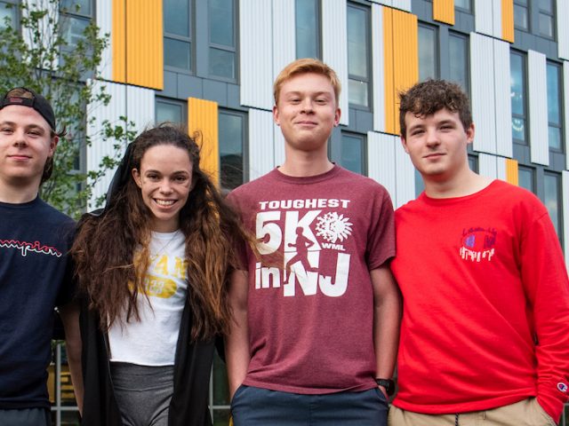 Group of first year students in front of Holly Pointe Commons.