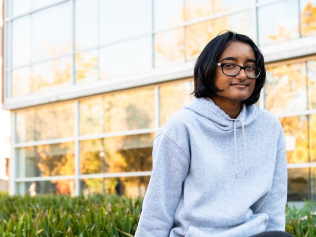 Asian Cultural Association member Mita Ray sits outside Savitz Hall.