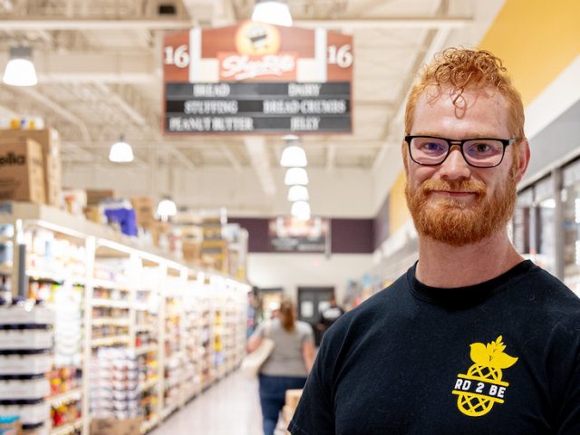 Jeramie stands inside a local ShopRite as part of the research he worked on in his program.