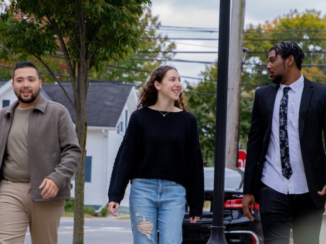 Gabby and her classmates walking past 301 High Street.