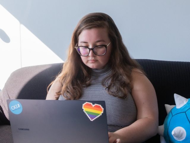 Lauren works on her computer.