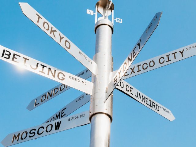 Public art display of city names on campus.