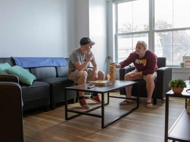 Roommates hang out in their 57 North Main apartment.