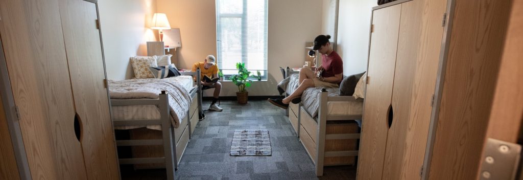 Two first year students hang out in their dorm.