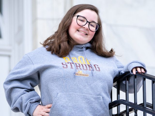 Lauren stands on the steps of Bunce Hall.