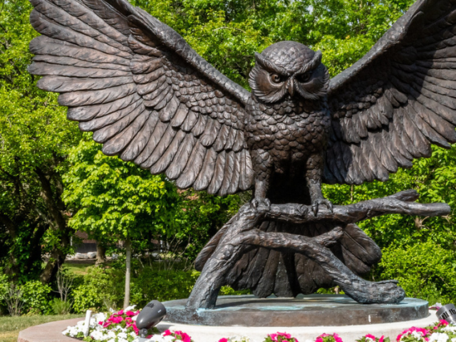 Image of prof statue near Robinson and James Halls.