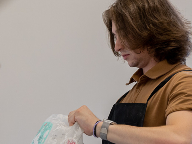 Dom is working on cast mold in the lab.