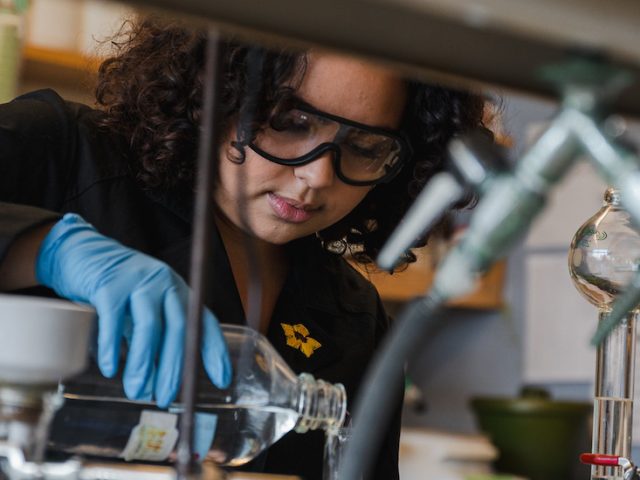 Rowan Biological Sciences major Aryana M. works in a lab.