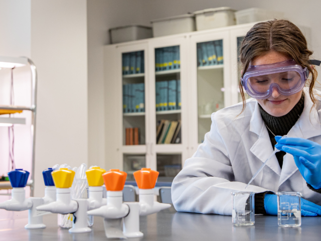 Rowan University Molecular and Cellular Biology major Lauren conducts research inside Discovery Hall.