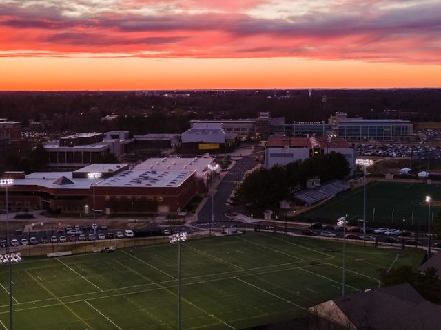 Dramatically colored sunset over the Rowan athletic field where John played football.