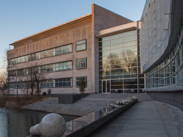 Serene sunset photo of Engineering Hall as seen from the pond.