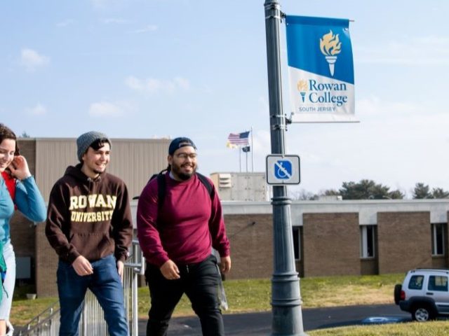 Three students walking around Rowan College of South Jersey campus.