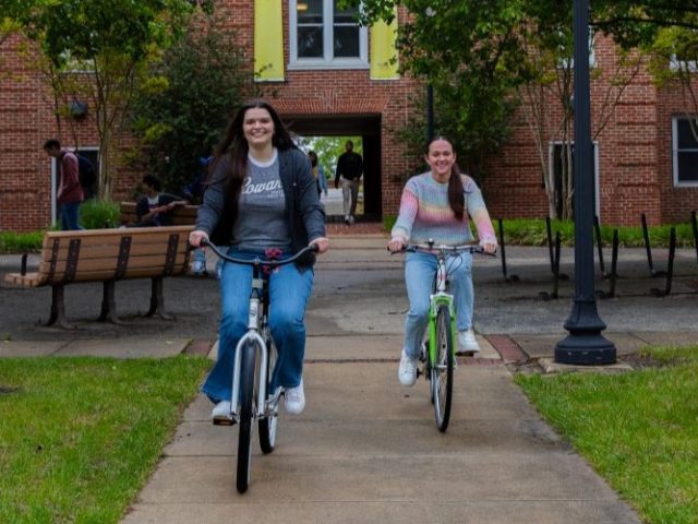 Two friends riding bikes.