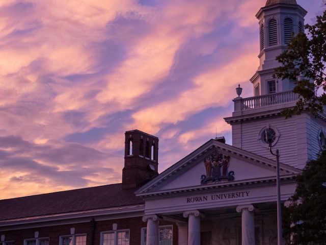 Pink sunset above the iconic roof of Bunce Hall.