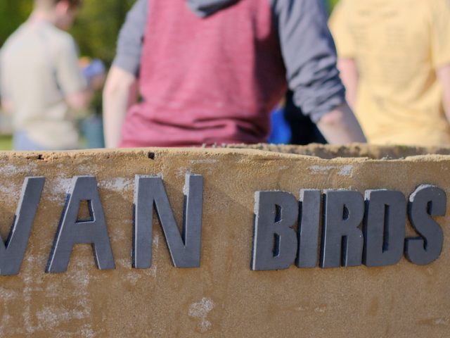 A close up of the side of the Rowan concrete canoe.