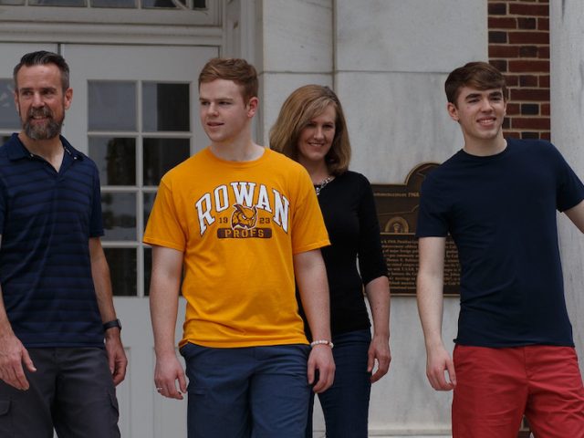 Rowan parents and their children stand on Bunce steps.