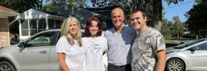 Kim stands with her family on Connor's move in day.